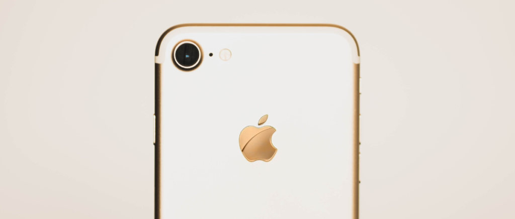 Back of white and rose gold iPhone for contacting freelance clients.