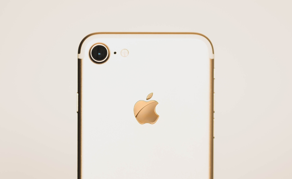 Back of white and rose gold iPhone for contacting freelance clients.